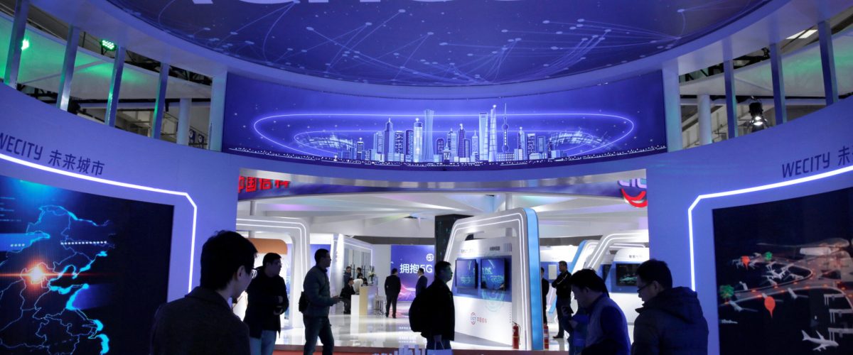 FILE PHOTO: People visit Tencent's booth at the World 5G Exhibition in Beijing, China November 22, 2019. REUTERS/Jason Lee/File Photo